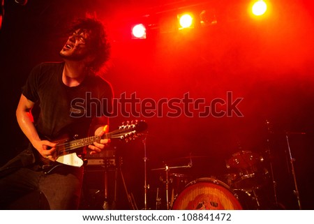 SEATTLE - JULY 21:  Rock guitarist and singer Jordan Cook aka Reignwolf performs on stage at Neumos during the Capitol Hill Block Party in Seattle, WA on July 21, 2012.