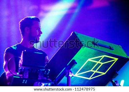 SEATTLE - SEPTEMBER 3, 2012:  French electronic pop band M83 performs on the main stage at Key Arena during the Bumbershoot music festival in Seattle on September 3, 2012.