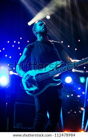 SEATTLE - SEPTEMBER 3, 2012:  French electronic pop band M83 performs on the main stage at Key Arena during the Bumbershoot music festival in Seattle on September 3, 2012.