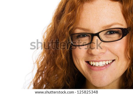 A beautiful girl with naturally curly red hair and freckles.