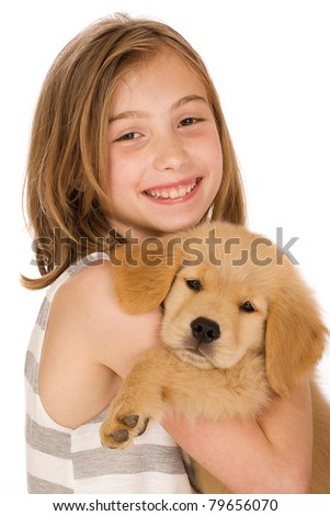 girl holding puppy