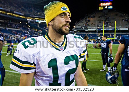 SEATTLE - AUGUST 21:  Superbowl Champion Green Bay Packers Quarterback Aaron Rodgers walks on Qwest Field after winning a football game August 21, 2010 in Seattle, Washington.