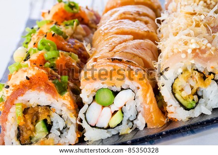 A diverse selection of delicious Japanese sushi rolls.