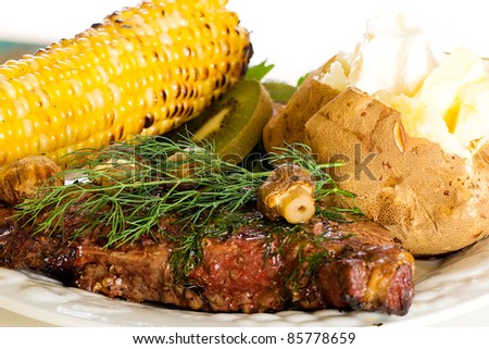 Food:  A grilled steak topped with mushrooms and dill, garden fresh corn on the cob and a steaming hot baked potato for dinner.