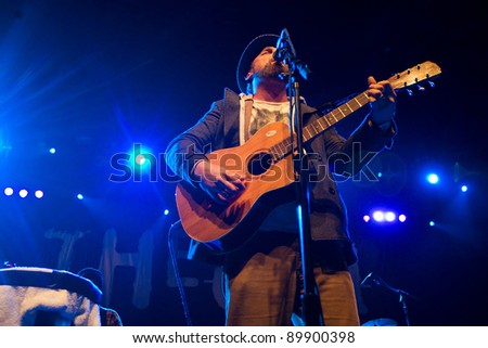 SEATTLE - DECEMBER 8, 2011:  John McCrea of alternative rock band Cake performs on stage during the Deck the Hall Ball in Seattle on December 8, 2011.
