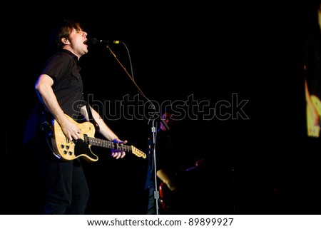 SEATTLE - DECEMBER 8, 2011:  Jim Adkins of American alternative rock band Jimmy Eat World performing on stage during the Deck the Hall Ball in Seattle on December 8, 2011.