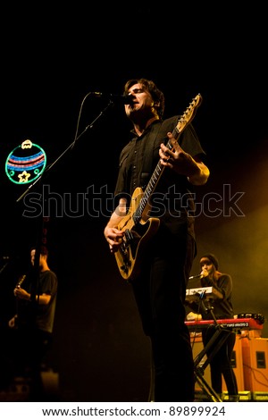 SEATTLE - DECEMBER 8, 2011:  Jim Adkins of American alternative rock band Jimmy Eat World performing on stage during the Deck the Hall Ball in Seattle on December 8, 2011.