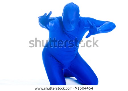 Faceless man in a blue body suit reaching out toward the camera.