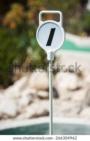 Mini Golf hole 1 marker on an outdoor mini golf course