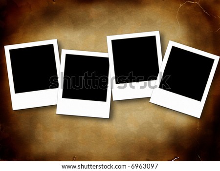 Blank photo frames on aged rusty background