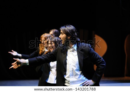 BARCELONA - JAN 13: Actors dressed in business suit, of the Barcelona Theater Institute, sing and dance in the comedy Shakespeare For Executives on January 13, 2013 in Barcelona, Spain.