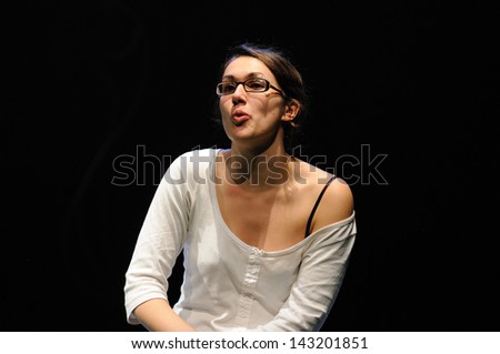 BARCELONA - JAN 13: An actress with glasses of the Barcelona Theater Institute, play in the comedy Shakespeare For Executives on January 13, 2013 in Barcelona, Spain.