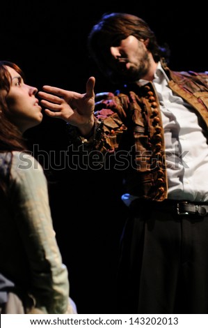 BARCELONA - JAN 13: An actor slaps an actress in the face. Both actors of the Barcelona Theater Institute, plays in the comedy Shakespeare For Executives on January 13, 2013 in Barcelona, Spain.