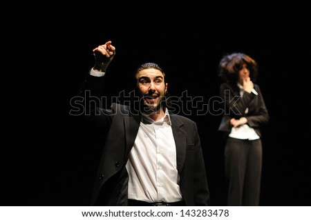 BARCELONA - JAN 13: Actors dressed in executive of the Barcelona Theater Institute, play in the comedy Shakespeare For Executives on January 13, 2013 in Barcelona, Spain.