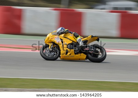 BARCELONA - APRIL 24: A motorcycle runs at Montmelo Circuit de Catalunya, a motorsport race track, on April 24, 2012 in Barcelona, Spain.