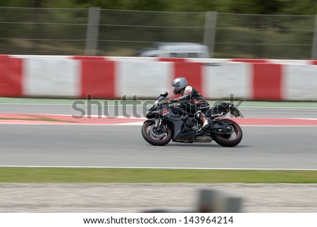 BARCELONA - APRIL 24: A motorcycle runs at Montmelo Circuit de Catalunya, a motorsport race track, on April 24, 2012 in Barcelona, Spain.