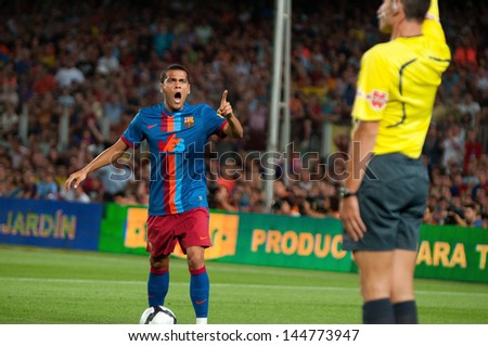 BARCELONA - AUG 19: Daniel Alves, F.C Barcelona player, angry with the referee. Joan Gamper Throphy at the Camp Nou Stadium on August 19, 2009 in Barcelona, Spain.