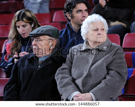BARCELONA - NOV 10: Two old men watch a football match at the Camp Nou Stadium on the Spanish Cup (Copa del Rey) on November 10, 2009 in Barcelona, Spain.