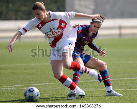 BARCELONA - MAR 14: F.C Barcelona women\'s football team play against Rayo Vallecano on March 14, 2010 in Barcelona, Spain. Superliga (Women\'s Football Spanish League) match.