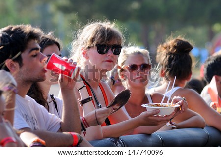 BENICASIM, SPAIN - JULY 19: The famous Hollywood actress Kirsten Dunst watches a concert at FIB (Festival Internacional de Benicassim) 2013 Festival on July 19, 2013 in Benicasim, Spain.