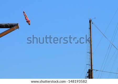 BARCELONA - JULY 30: Anna Bader, jumps from the High Diving Tower at the final of women\'s high altitude jumps at Barcelona Swimming World Championship on July 30, 2013 in Barcelona, Spain.