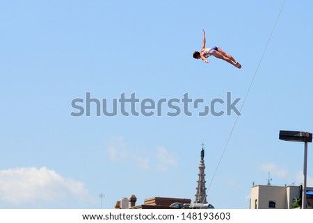 BARCELONA - JULY 30: Cesilie Carlton, jumps from the High Diving Tower at the final of women\'s high altitude jumps at Barcelona Swimming World Championship on July 30, 2013 in Barcelona, Spain.
