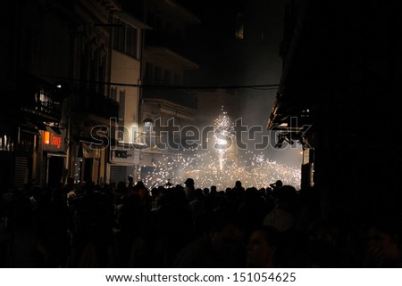 BARCELONA - AUG 17: Fire devils in the Fire-Run (Correfoc) as part of the Mollet estival party (festa major) on August 17, 2013 in Mollet del Valles, Barcelona, Spain.