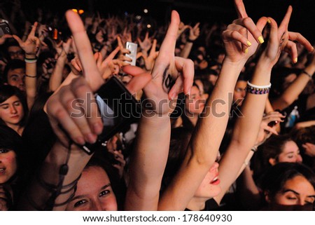 BARCELONA - MAR 13: Fans from the crowd of Simple Plan band at Razzmatazz on March 13, 2012 in Barcelona, Spain.