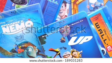 BARCELONA, SPAIN - APR 18, 2014: A collection of films by Disney Pixar Animation Studios on Blu-ray, including Finding Nemo, Up, Wall-e, Toy Story, Monsters and Ratatouille.