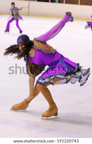 BARCELONA - MAY 03: Young team from a school of skating on ice performs, disguised as hippies, at the International Cup Ciutat de Barcelona Open on May 3, 2014 in Barcelona, Spain.