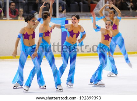BARCELONA - MAY 03: Young team from a school of skating on ice performs, disguised as sirens of the sea, at the International Cup Ciutat de Barcelona Open on May 3, 2014 in Barcelona, Spain.