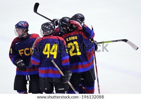 BARCELONA - MAY 11: F.C. Barcelona players celebrate a goal in the Ice Hockey final of the Copa del Rey (Spanish Cup) against Jabac Terrassa team on May 11, 2014 in Barcelona, Spain.