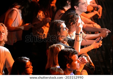 BARCELONA - MAY 16: People in the first row in a concert at Razzmatazz discotheque on May 16, 2014 in Barcelona, Spain.