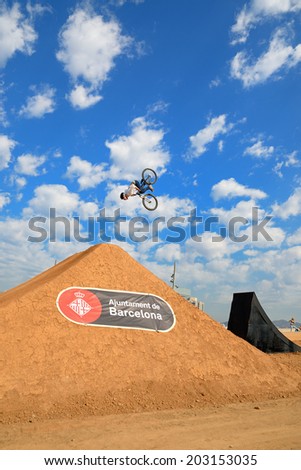 BARCELONA - JUN 28: A professional rider at the MTB (Mountain Biking) competition on the Dirt Track at LKXA Extreme Sports Barcelona Games on June 28, 2014 in Barcelona, Spain.