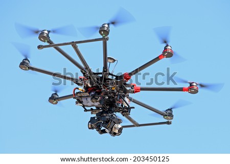 BARCELONA - JUN 28: A drone controlled by remote control, to take pictures and video recording at LKXA Extreme Sports Barcelona Games on June 28, 2014 in Barcelona, Spain.
