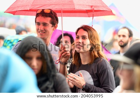 BARCELONA - MAY 28: People with umbrellas watching a concert under the rain at Heineken Primavera Sound 2014 Festival (PS14) on May 28, 2014 in Barcelona, Spain.