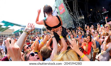 BARCELONA - JUN 12: MO (band) sings above the crowd (crowd surfing)  at Sonar Festival on June 12, 2014 in Barcelona, Spain.