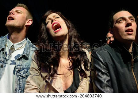 BARCELONA - MAY 31: A woman from the crowd screams in a concert at Heineken Primavera Sound 2014 Festival (PS14) on May 31, 2014 in Barcelona, Spain.