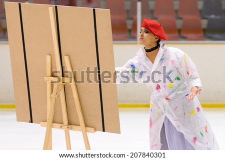 BARCELONA - MAY 03: Young team from a school of skating on ice performs, disguised as painters, at the International Cup Ciutat de Barcelona Open on May 3, 2014 in Barcelona, Spain.