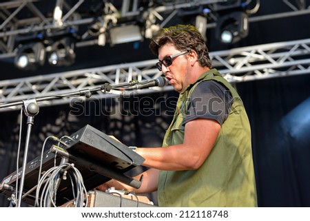 BENICASSIM, SPAIN - JULY 18: Keyboard player and singer of Los Claveles (band) performs with a Joy Division shirt at FIB Festival on July 18, 2014 in Benicassim, Spain.