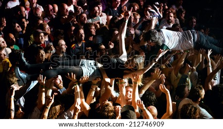 BARCELONA - MAY 30: The audience doing crowd surfing (also known as mosh pit) at Heineken Primavera Sound 2014 Festival on May 30, 2014 in Barcelona, Spain.