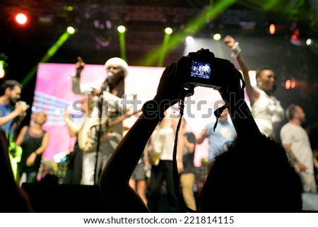 BARCELONA - JUN 14: People from the audience recording and taking pictures with their cameras at Chic featuring Nile Rodgers (band) show at Sonar Festival on June 14, 2014 in Barcelona, Spain.