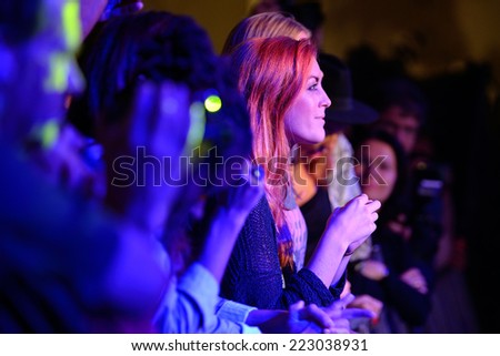 BARCELONA - SEP 23: Redhead woman from the audience applauding at Barcelona Accio Musical (BAM) La Merce Festival on September 23, 2014 in Barcelona, Spain.