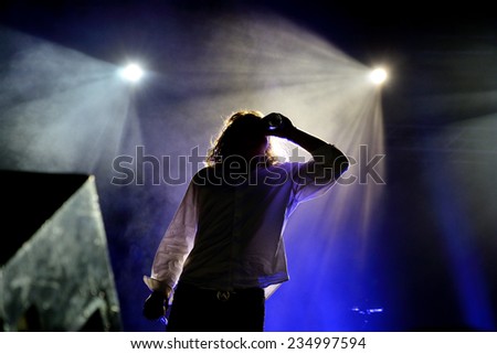 BILBAO, SPAIN - NOV 01: Frontman of The Orwells (band) drinks a can of beer during his concert at Bime Festival on November 01, 2014 in Bilbao, Spain.