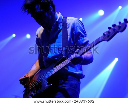 BARCELONA - DEC 10: The bass guitar player of Two Door Cinema Club (band) performs at Discotheque Razzmatazz on November 19, 2010 in Barcelona, Spain. Razzmatazz celebrates his 10th anniversary.