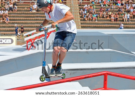 BARCELONA - JUN 28: A professional rider at the Scooter Pak competition on the Central Park at LKXA Extreme Sports Barcelona Games on June 28, 2014 in Barcelona, Spain.