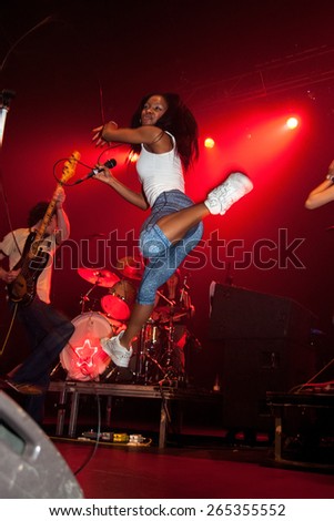 BARCELONA - APR 1: Nkechi Ka Egenamba, rapper and the female lead vocalist for the indie band The Go! Team, jumps at Razzmatazz stage on April 1, 2011 in Barcelona, Spain.