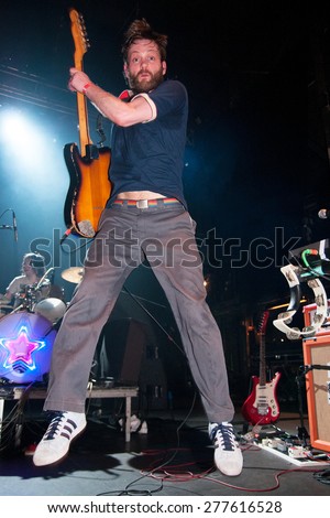 BARCELONA - APR 1: The guitar player of The Go! Team (band) jumps during his performance at Razzmatazz Club on April 1, 2011 in Barcelona, Spain.
