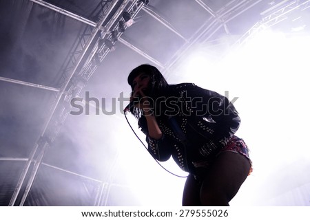 BARCELONA - JUN 1: Silhouette of Alexis Krauss, singer of Sleigh Bells band, who performs at San Miguel Primavera Sound Festival on June 1, 2012 in Barcelona, Spain.