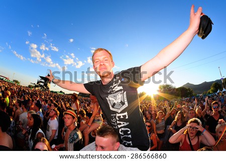 BENICASSIM, SPAIN - JULY 20: A man from the crowd in a concert at FIB Festival on July 20, 2014 in Benicassim, Spain.